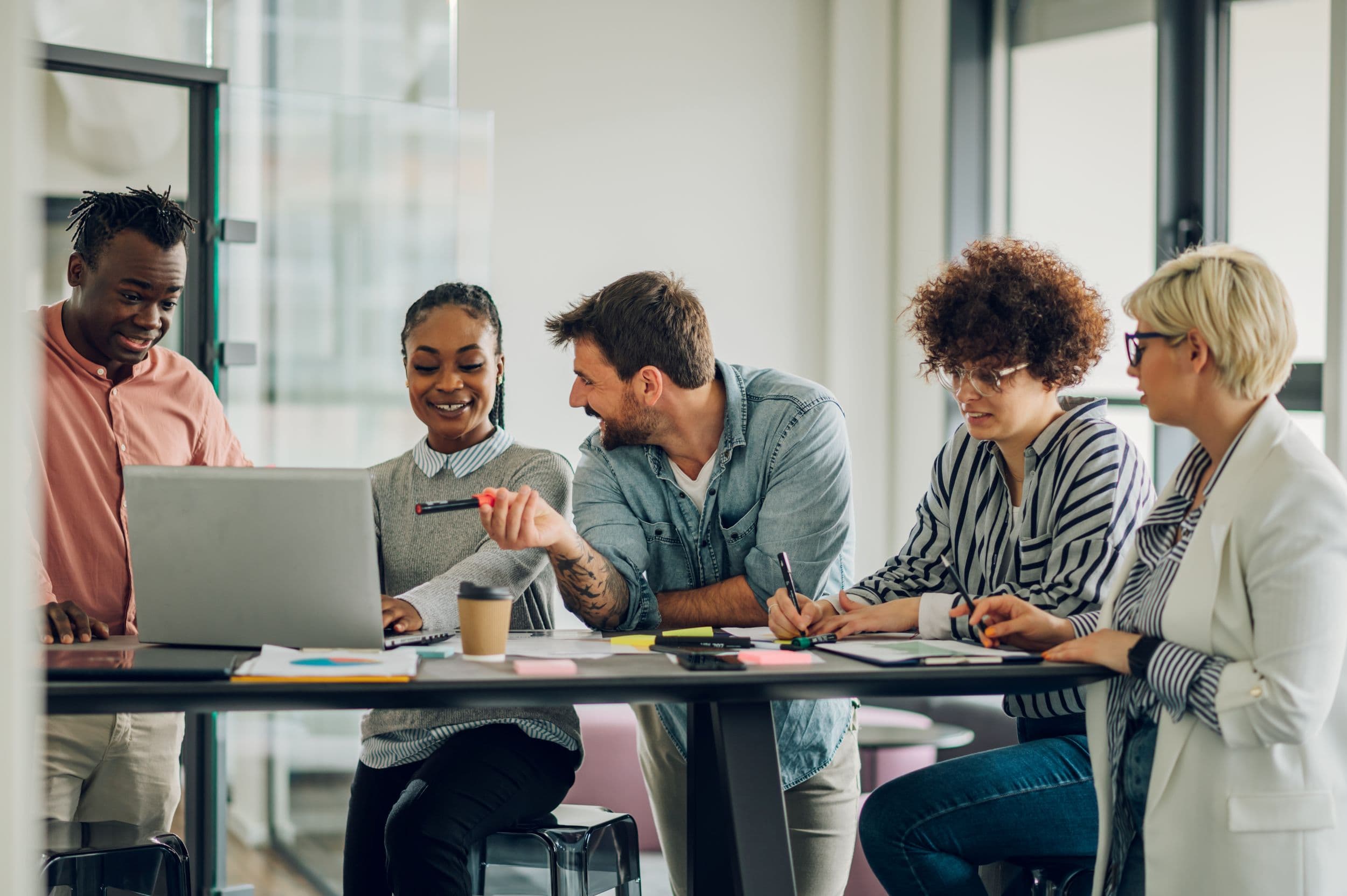 A diverse team of colleagues working together in an office