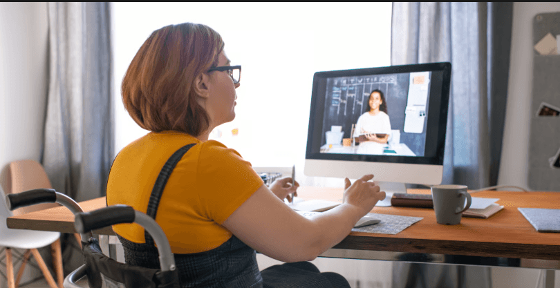 A Return Well clinician supporting an employee during a remote video consultation from home